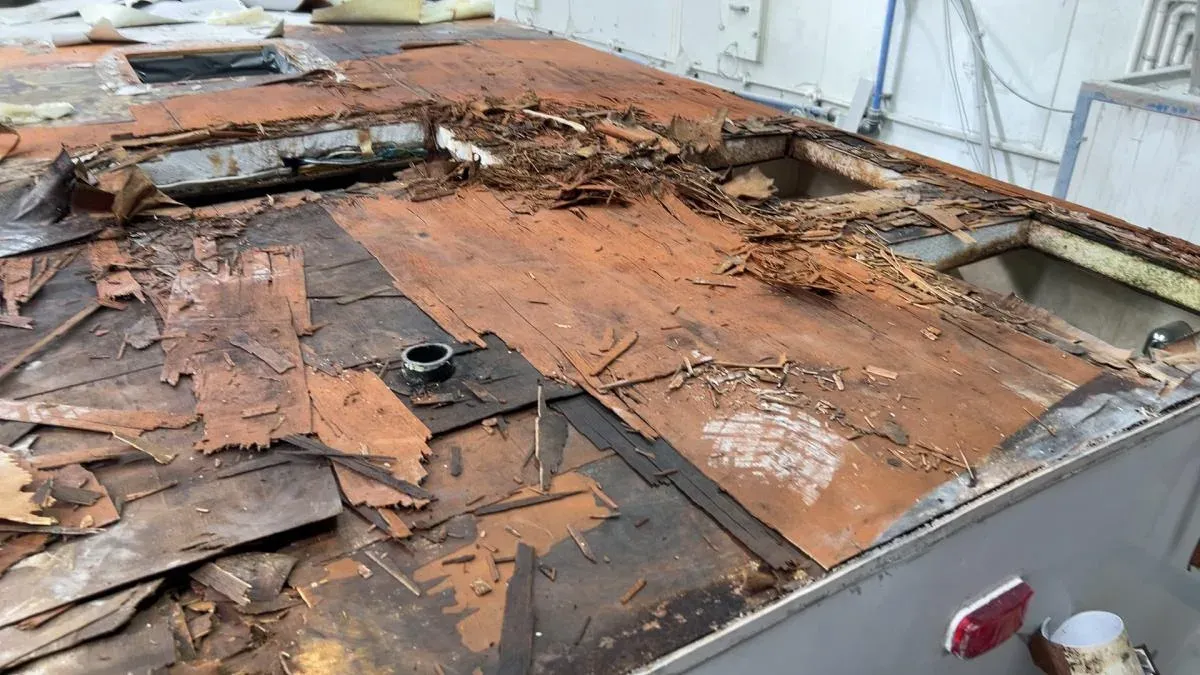 A caravan roof rotted and stripped back