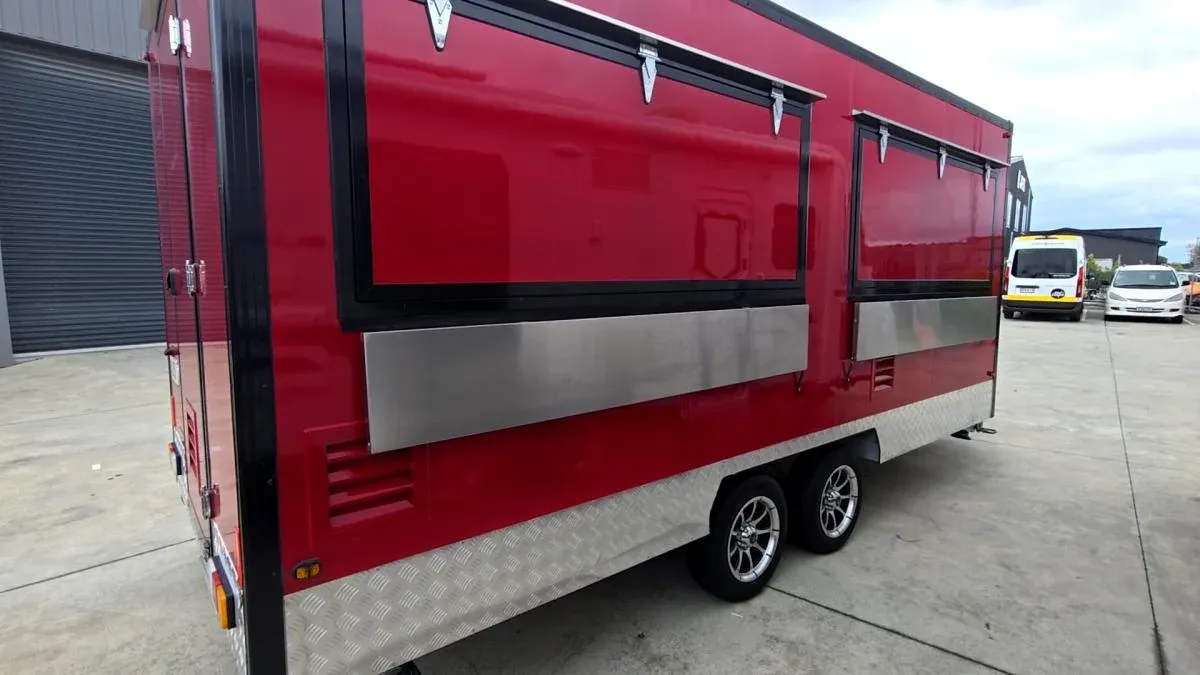 A custom-built red catering trailer finished in the workshop