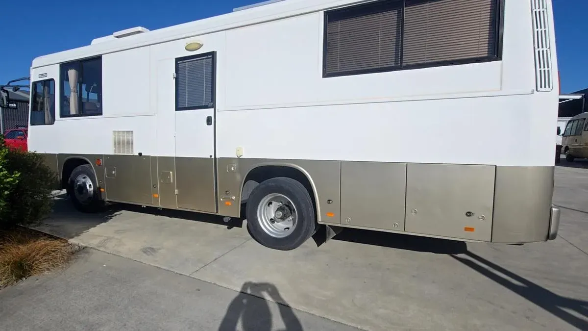 A white coach motorhome after a full respray