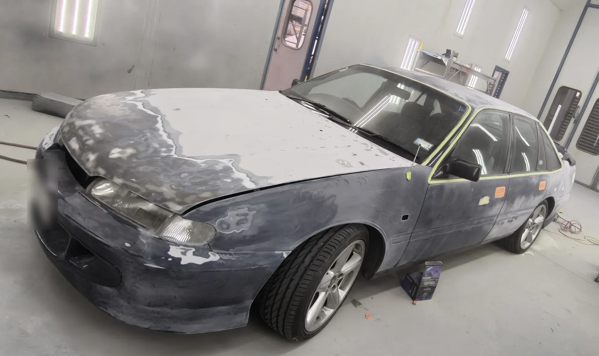A Holden Commodore prepped and part-sanded in the spray booth
