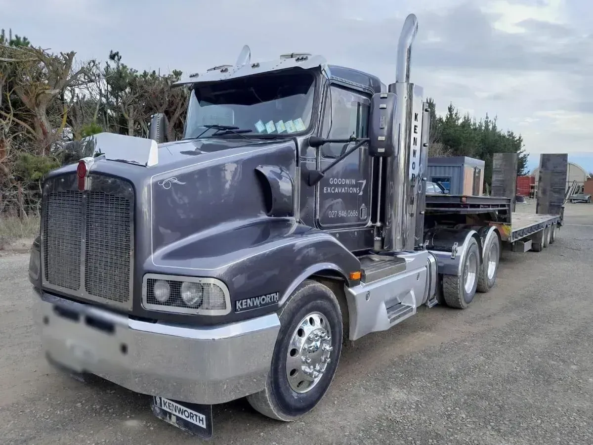 A Kenworth truck with flat-deck trailer