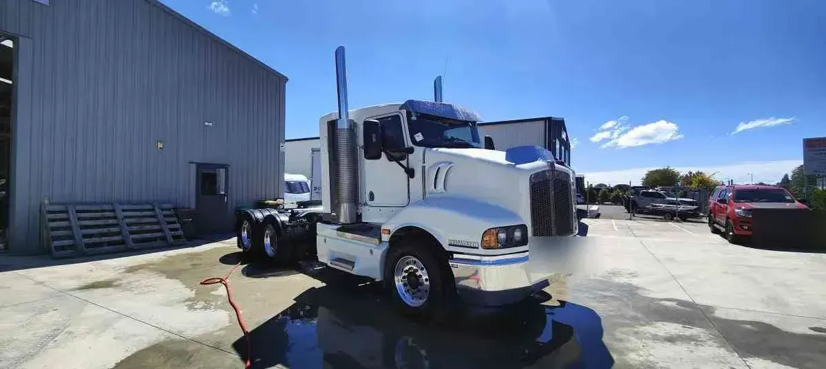 A white Kenworth truck after rust repair and respray