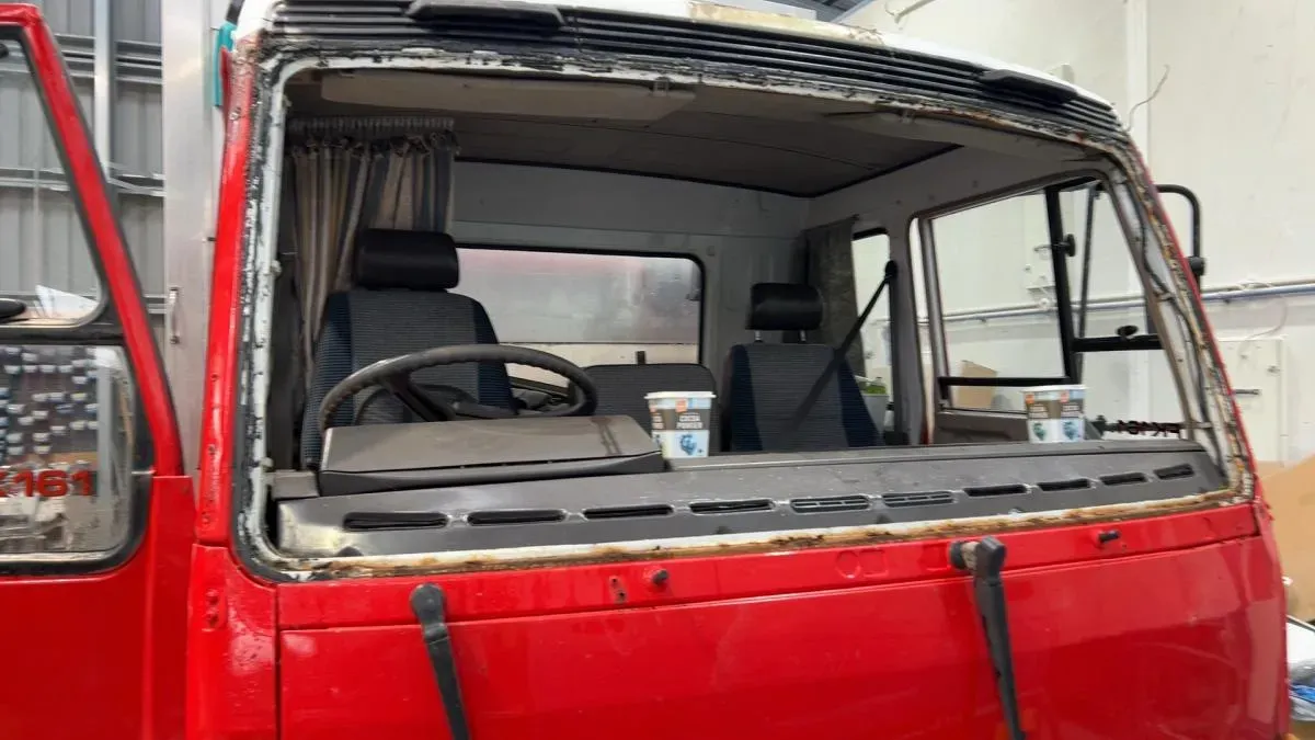 A truck cab with the windscreen out for replacement