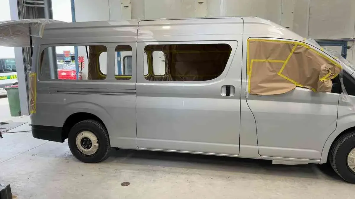 A van masked up mid-respray in the workshop